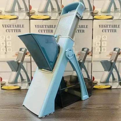 Blue vegetable cutter on a wooden surface with multiple product boxes in the background.