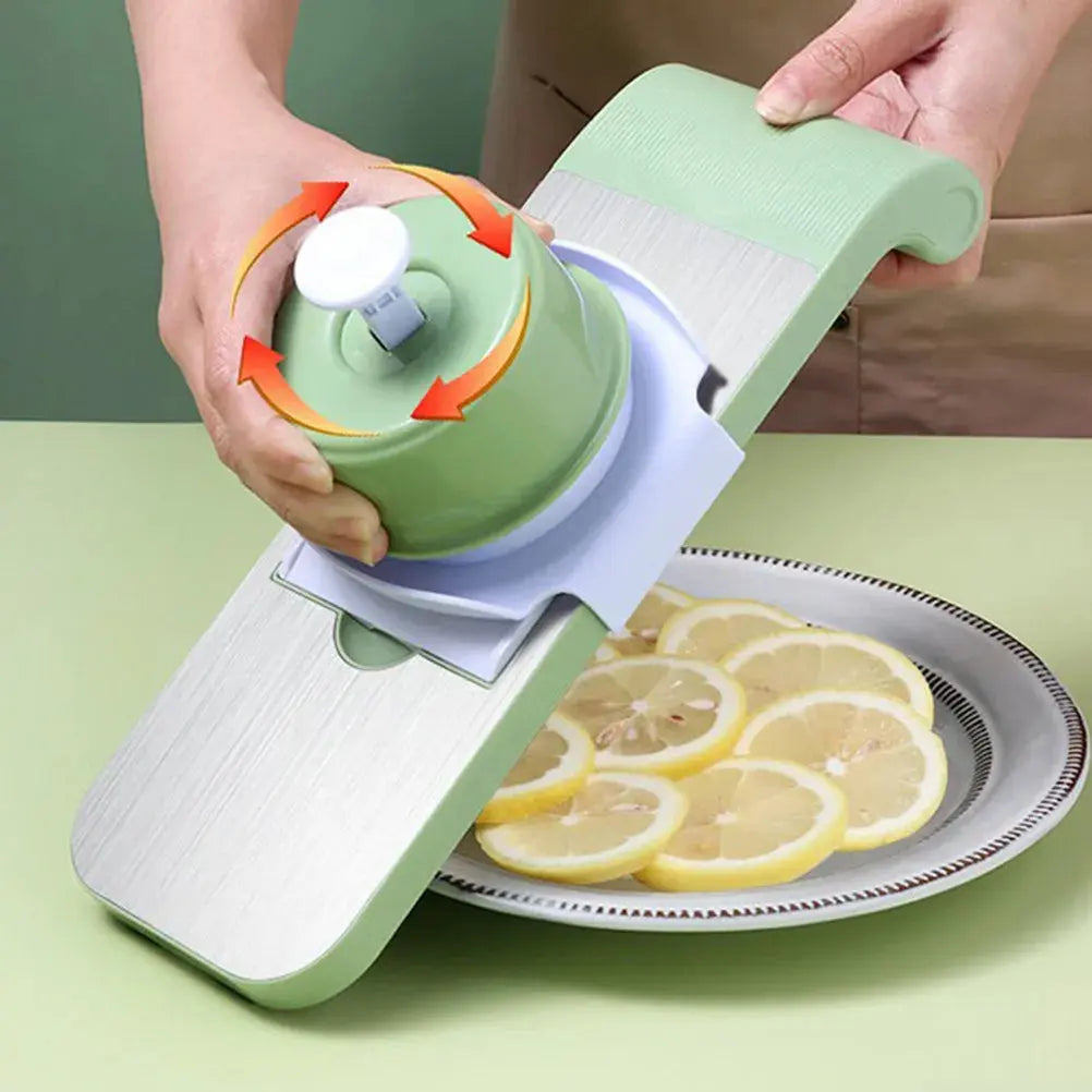 Person using a green mandoline slicer to slice lemons on a plate.